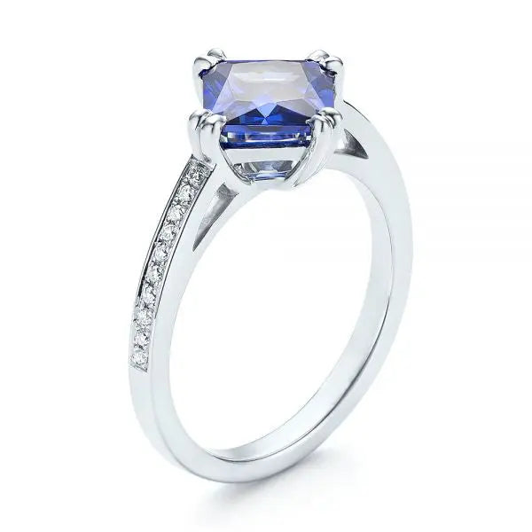 Vivid Tanzanite Halo Ring with Gemstone Accents UNA.CO