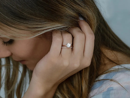 Moissanite engagement ring wet with water drops