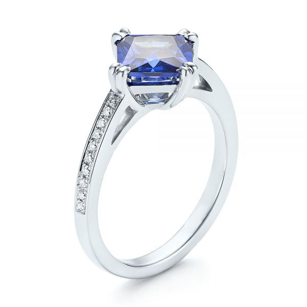 Vivid Tanzanite Halo Ring with Gemstone Accents